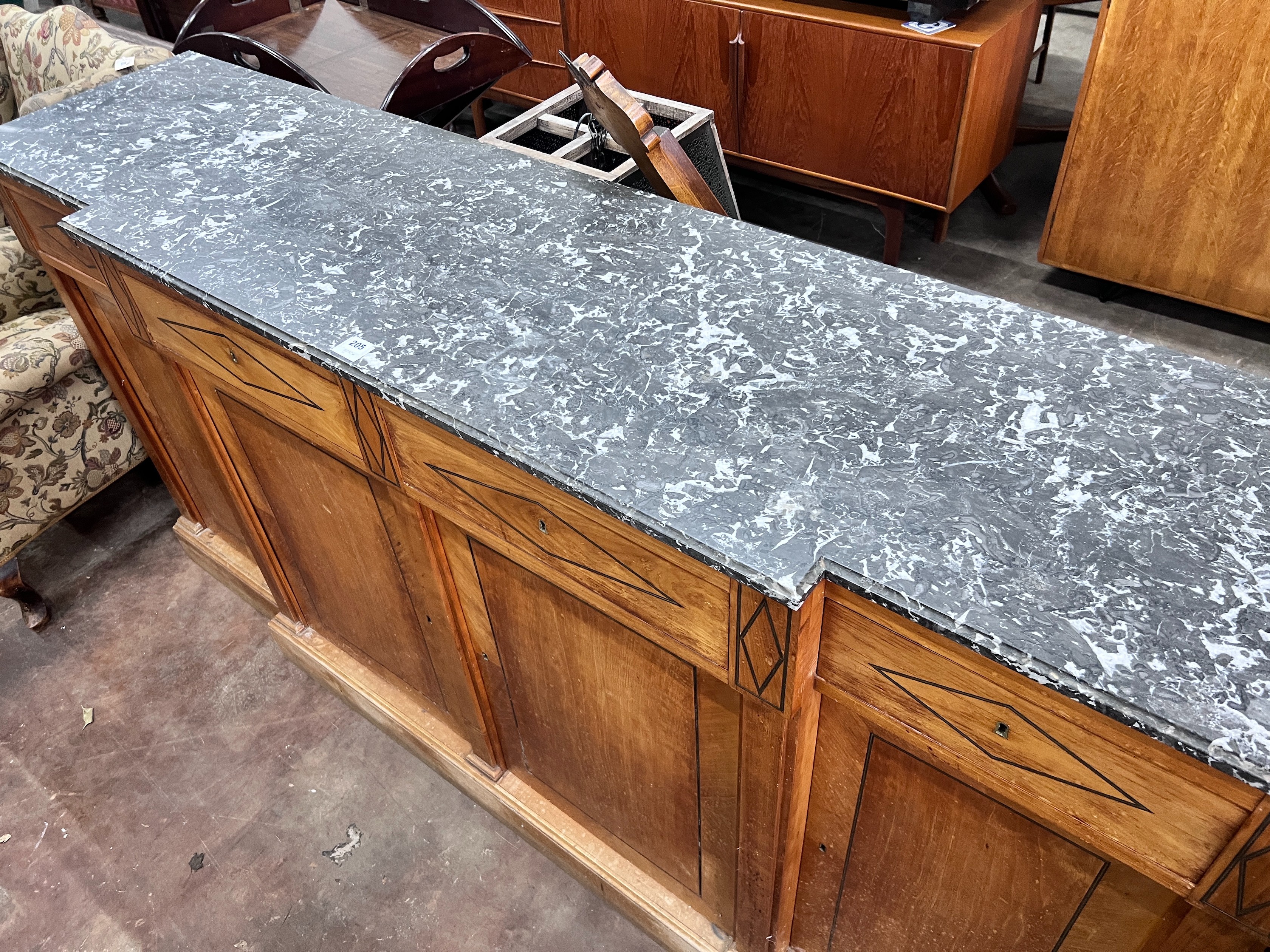 A continental marble topped fruitwood breakfront bookcase, with variegated grey marble top, four drawers and four doors, width 207cm, height 103cm *Please note the sale commences at 9am.